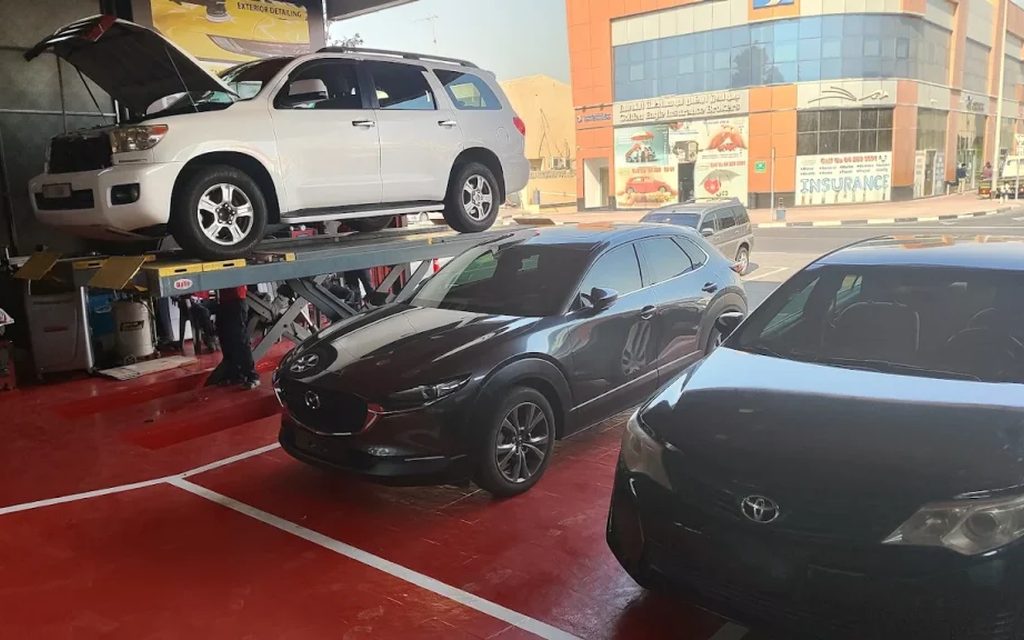 The Peeyesyem detailing bay in Al Khabaisi, Deira, with vehicles being worked on